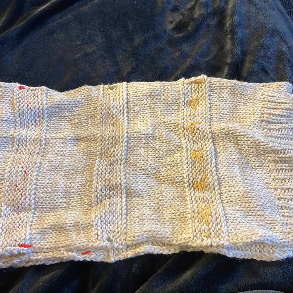 Wool rich knitted scarf with Color’s knitted into them.